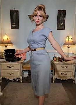 Dainty rascal dancing in vintage blue wiggle dress