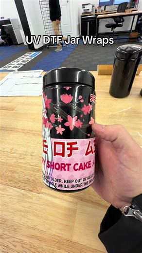 UV DTF Jar wraps. Ignore the black UV ink on my thumb 😂 it is starting to tingle lol. But these UV DTF stickers are perfect for jar wraps! #stickerbros #uvdtf