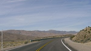 Drive Plate-POV-Driving around a curve on US Highway 93 in the Nevada desert-View forward
