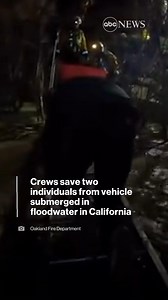 Teams used multiple ladders to conduct a successful rescue of two adults trapped on top of their truck that was submerged in floodwater in Hollister, California. https://abcn.ws/3X4hjRL | ABC News