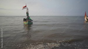 Footage of traditional boat on the beach when sunset is coming with cloudy sky. Dramatic and nature scene for transition shot film, traveler and holiday destination. Stock Video