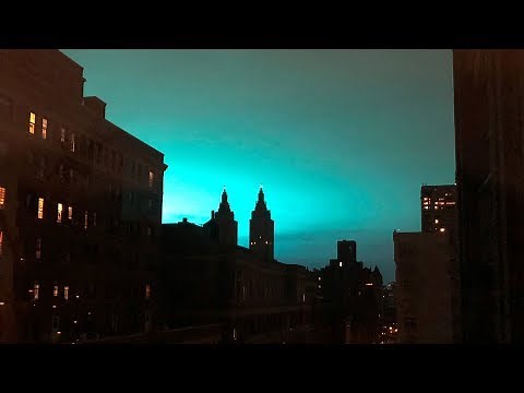 Eerie blue glow lights up the skies above New York City