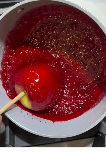Red Candy Apples Ingredients: \t•\t1 ½ cups sugar \t•\t½ cup water \t•\t¼ cup corn syrup \t•\t5–7 drops red gel food coloring \t•\t4–5 medium apples Instructions: \t1.\tPrepare the Apples: \t•\tBring a pot of water to a boil. \t•\tDip each apple into the boiling water for 5 seconds to remove any wax coating. \t•\tDry each apple thoroughly with a clean cloth. \t•\tInsert a wooden stick into the bottom of each apple and place them on parchment paper. \t2.\tMake the Candy Coating: \t•\tIn a medium 