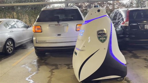 The start of the AI robot takeover? 😂🤣😂 DubBot (a Dublin Police security robot) blocked my wife from leaving the parking garage in Dublin. A human officer arrived, but DubBot eventually moved along! Humanity won this round. | Mike McCarthy