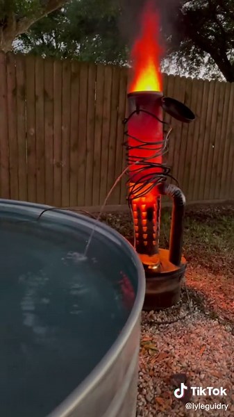 Heating my stock tank pool with a smudge pot #stocktankpool #smudgepot #fire #summervibes