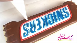 40K views · 264 reactions | I had no idea Snickers Candy Bar is 90 years old? Did you know that? Here are some Snickers Candy Bar cookies I decorated with royal icing. I think it would have been cool to use peanut butter cookies and caramel and chocolate royal icing. What do you think? | Haniela's | Facebook