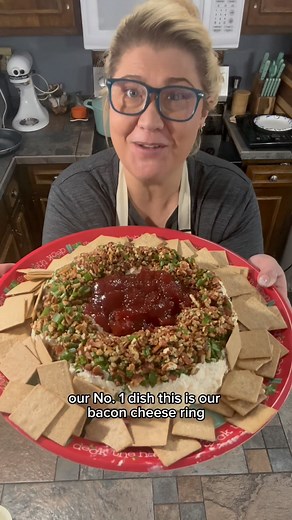 Ashley Ripple on Instagram: "Our #1 recipe and family favorite is our Bacon Cheese Ring! Shopping List is in the comments: Ingredients: 1lb bacon 8oz cream cheese 1 cup sour cream 1 cup mayo 1 tbsp bacon grease 2 cups mozzarella 2 cups sharp cheddar 1/4 tsp salt and garlic powder 1 tsp pepper 2 bundles green onion 2-3cups chopped pecans Wheat thins Smucker’s strawberry jam Combine 1/2 the bacon, 1 bundle of green onions, and pecans into the bottom of your Saran wrapped bundt cake pan for the top