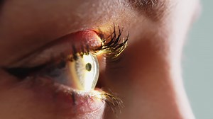 Download Eye iris and pupil macro. Reflected moving light rays into the human eye with zoom. Close up. The concept of ophthalmology and medicine. Medical attendance at the optometrist in a bright modern clinic for free