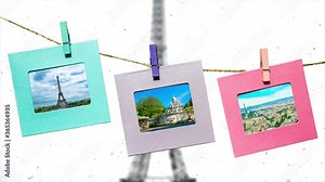Creative slow motion parallax video of the main sights of Paris in summer in funny frames on a rope with clothespins against the backdrop of the panorama of Paris with the Eiffel Tower in winter.