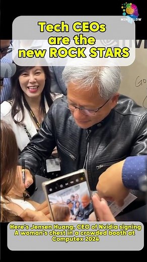 Here’s Jensen Huang, CEO of Nvidia signingA woman’s chest in a crowded booth at Computex 2024