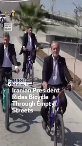 Iranian President Masoud Pezeshkian rides a bicycle through empty streets in Isfahan surrounded by bodyguards forced to run after him. #IranianPresident #IranPresidentOnBicycle | Al Arabiya English