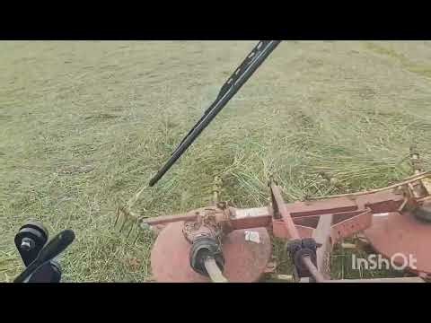 LS MT468 Paired Up To A New Holland 254 Tedder/Rake