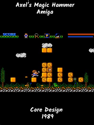 Axel’s Magic Hammer – Commodore Amiga – Core Design (1989) When Core Design mixes fairy-tale charm with fast-paced arcade action… a magical Amiga classic is born ✨🧚‍♂️ Released in 1989, Axel’s Magic Hammer throws you into a whimsical fantasy world where timing, reflexes, and precision are everything. Armed with a magical hammer, Axel must survive a relentless series of single-screen challenges filled with enemies, traps, and platforming chaos. This isn’t a gentle fairy tale. One hit and it’s ov