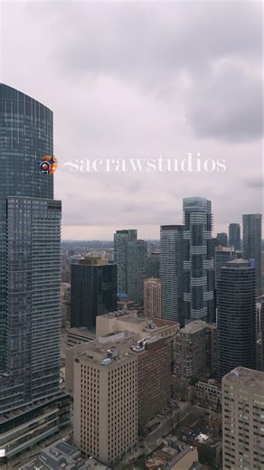 Aerial View of Modern Downtown Skyline with Glass Skyscrapers Under Overcast Sky