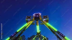 Extreme carousel at funfair at sunset