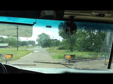 Railroad Crossing in a Yellow Bus