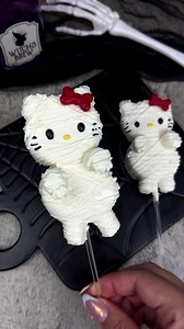 Hello Kitty marshmallow mummies! How cute are these! I think Hello Franken-Kitty is a must now. Using Stover's Confection Connection sweet shoppe ultra white melting wafers for this cutie. #halloween #marshmallow #marshmallows #dippedmarshmallows #chocolatecoveredmarshmallows #marshmallowpops #hellokitty #spookyseason #halloween #halloweenparty #desserts #desserttable #halloweenideas #mummy #halloweentreats #halloweenbaking #halloweeninspo #spookyseason #spookyszn #spookytreats #hellokittycore #