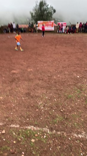 Exciting Youth Soccer Match on Muddy Field