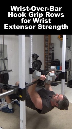 Nick Nilsson on Instagram: "Wrist-Over-Bar Hook Grip Rows for Wrist Extensor Strength - this is a really interesting one inspired by the "tennis ball hook grip exercise" you may have seen calisthenics athletes do. That exercise strengthens the wrists and is very helpful for progression to muscle-ups. This is the opposite hook style, working the extensors of the wrist (primarily isometrically) instead of the flexors using an inverted row and isometric hold. This pronated-hand rowing movement also