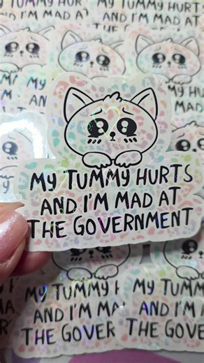My Tummy Hurts and I'm Mad At The Government holographic stickers in my shop! Super Cyber Sale all week plus freebies with every order! LiberalLeafStickers.etsy.com #stickershop #holographicstickers #glitterstickers #leftiststickers #cutestickers