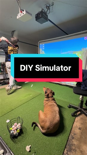 Mason hitting on the new DIY simulator in the garage. Still working out some kinks as you can see the bounce back is strong, but George likes watching the balls go by. Thinking of how to get some siding or possibly a better screen setup. Lmk if you guys have any ideas! @masonhorn_ #golfsimulator #simulator #golf #diygolfsimulator #garagesimulator