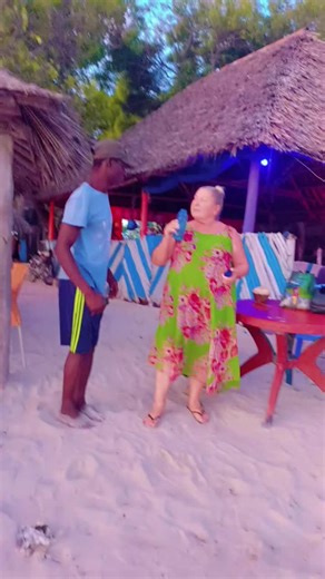 Beach Conversation Between Two Friends at Sunset