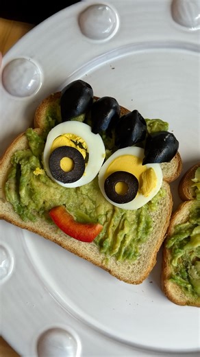 Halloween breakfast just got a monstrous upgrade! 💚🥑Eggland’s Best Hard-cooked peeled eggs top this Frankenstein Avocado Toast for a spooky, fun, protein-packed start your little goblins will love. | Eggland's Best Eggs