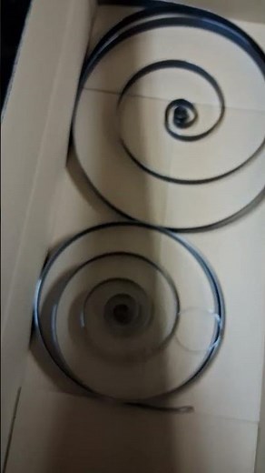 Victrola Repair info. One method of removing retaining wire from New motor springs.