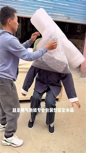 Wax statue of old man packaged for museum delivery