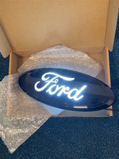 Illuminated Ford Logo: Day and Night Comparison