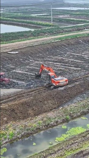 Excavator Digging Fish Pond in Farmland