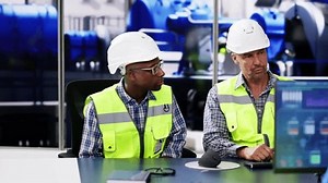 Operators training At Power Generation Plant. Diverse Employee Group