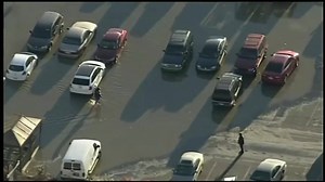 A massive water main eruption swallowed a parking lot full of cars at a strip mall in Philadelphia ---> http://nbcct.co/ZVtuTaK | NBC Connecticut