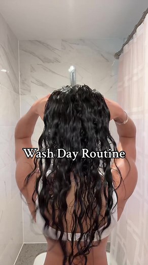 My curly/wavy hair wash routine 🧖🏽‍♀️: -First I cowash with “As I Am” cowash & brush with denman brush. -Shampoo with Ouai-thick hair shampoo -Condition 2 with Ouai-medium conditioner *massage scalp with “O So Curly” massager. - Curly Recovery Mask from Ouidad (clip up & let sit for 5 mins) brush wirh wide tooth comb. -Rinse & put hair in microfiber towel and do body routine. After the shower: -Seal ends with Olaplex oil -Scalp oil massage with Mielle Rosemary Oil -Leave-in conditioner from “A