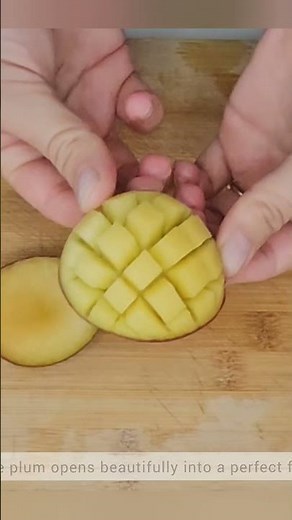 A perfect plum fan created with gentle pressure and precise shallow cuts.