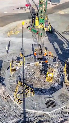 This is about a process of large-diameter shaft drilling. After constructing the slab and pre-sink, the drilled shaft in the secant pile wall is put on a crane. | Interesting Engineering