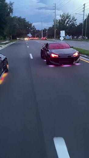 Sleek Sports Car Showdown: Red or Bronze Underglow?