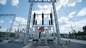 Electrical engineers inspect the electrical systems at the equipment control cabinet