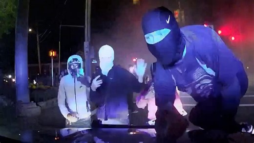 Video: 2025: Large crowds take over boston street and block cars to perform stunts | Daily Mail Online