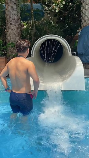 Fun Water Slide Adventure in a Pool