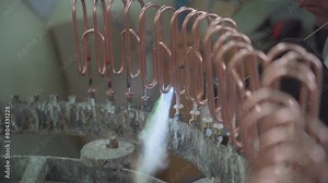 Factory production of heating element. Welding of Heating exchanger in workshop. Manufacturing heating element. Mass factory production.