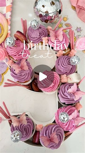 Caitlin Kruse on Instagram: "New favorite birthday cake alternative!! Comment BIRTHDAY for links. 100% planning to do this for all parties moving forward, it was such a hit! I walked into Whole Foods the day before the party and picked out cupcakes to match our theme and got lucky with these! The kids loved it 😍Be sure to measure the number size before you order so it's to scale. I think mini cupcakes would be fun, too!"