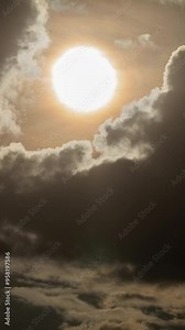 Vertical Time-Lapse of Cloud Movement at Sunrise with the Sun Appearing in the Morning Sky