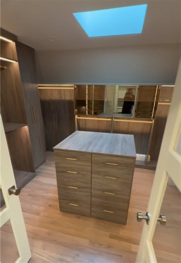 You’ve seen this closet before, but not like this. This new view shows what makes custom design so powerful: every detail working together in one seamless space. Warm Southwester tones, upgraded Häfele Tag Signature hardware, integrated lighting, and storage planned with purpose from top to bottom. From this angle, you can really see how the materials, lighting, and layout create more than organization, they create an experience. #customcloset #luxurycloset #closetinspo #dreamcloset #fyp