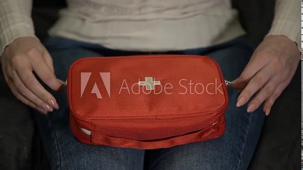 medicines and first aid kit. open the first aid kit. Slow motion video. High quality video in 4K format.