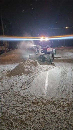 Tractor Snow Blower Removing Snow Bank