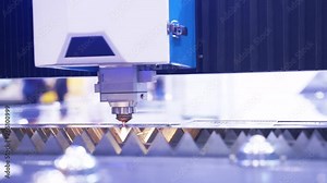 Cut sheet metal at workshop. Modern tool in heavy industry. lot of bright sparks. High precision manufacture of steel parts. Automatic work for ironwork. Close up. computer cnc.