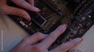 Close-up, Repairing or installing hard disk type M.2 on computer motherboard. Workload on night. Stock Video