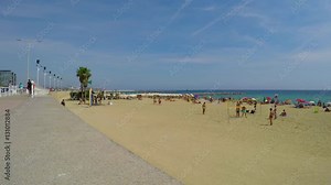 Boys Playing Beach Volleyball In Speedos