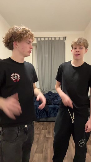 Playful Dance Routine in Casual Bedroom Setting